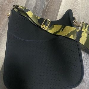 Ahdorned crossbody messenger bag.